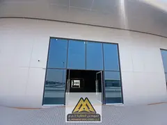 Service shop for rent, large space suitable for all activities, in Al Bahia area on Mohammed Bin Zay