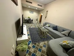 Two bedrooms and a living room / Fully furnished / Al Thuraya Building 1 / Al Rashidiya 3 / Open vie