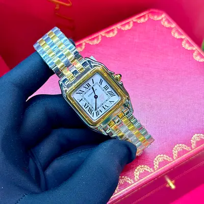 This is a Cartier Panthère de Cartier watch featuring a distinctive two-tone steel and yellow gold b