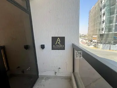 For annual rent in Ajman, Al Alia area: spacious studio apartment with a semi-detached kitchen and balcony.