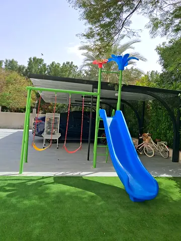 Outdoor kids playset with slide and two swings - good condition
