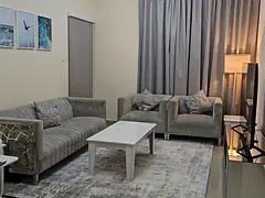 Two bedrooms and a living room / balcony / affordable price / open view / on the Dubai exit / Al Taa