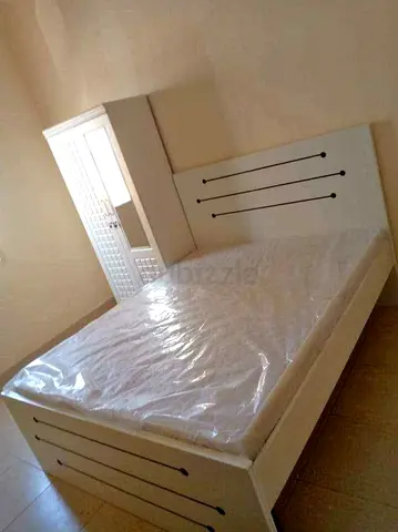 New White wooden Queen size bed with headboard and matching wardrobe