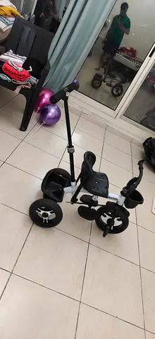 Kids tricycle with parent push handle — good condition