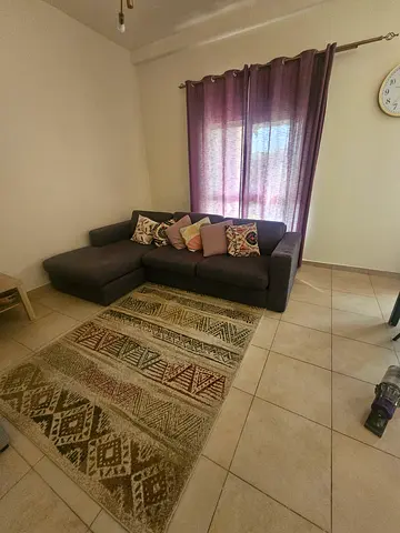 Home center L-shaped dark grey fabric corner sofa with chaise,i bought it 3 years back with 4500 dhs