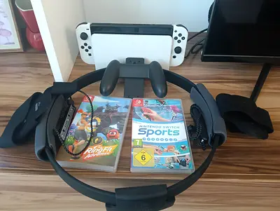 Nintendo switch OLED-2021 model with games and controllers