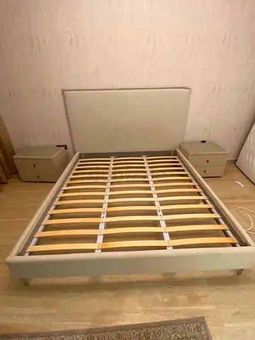 Queen upholstered bed frame with storage slats (beige)