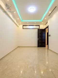 Two bedrooms and a living room for annual rent in Al Waha Towers, Rashidiya 1, overlooking the creek