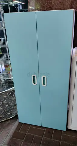 Light blue 2-door baby wardrobe / storage cabinet - good condition