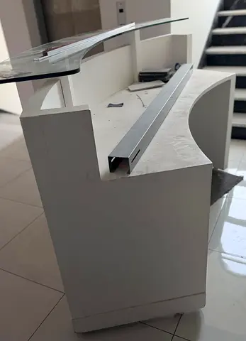 White reception counter / front desk with glass top
