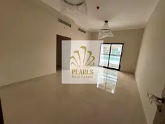 First-occupancy two-bedroom apartment for annual rent in Ajman – Al Rashidiya 1, near Mina Street.