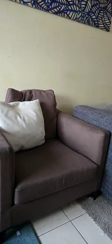 Single brown fabric armchair in good used condition