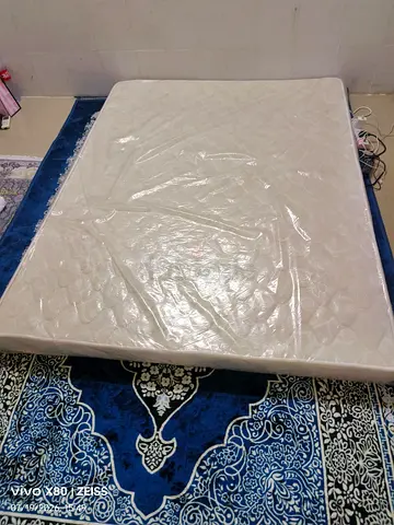 Comfortable White Mattress in Plastic Wrap