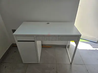 Simple white computer desk with drawer and cable hole