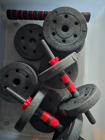 Adjustable dumbbell set with multiple weight plates and bars- unused