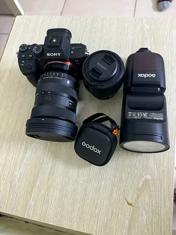 Sony Alpha 3 camera+50mm lens+sigma 24-70mm f2.8 lens+good v1 flash+Godoy trigger+benro bag