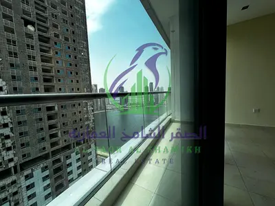 A luxurious two-bedroom apartment is available for rent in Al Khan Corniche, featuring stunning sea views