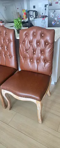 I have 6 chairs of vintage-style tufted leather dining chairs with solid wooden legs