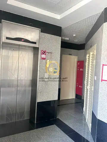 For sale: a building in Muwaileh with a ground floor and 3 floors, area 3000 sq ft. It has 9 apartments with a room, living room, kitchen, and 2 bathe