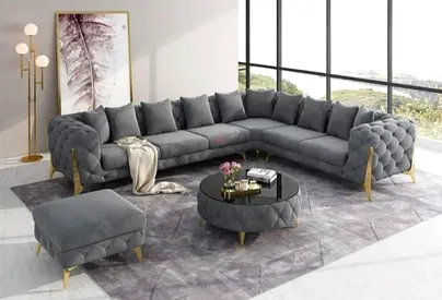 Large L-shaped tufted velvet sofa in dark grey - excellent condition