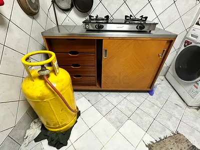 Gas cylinder with stove and cabinet