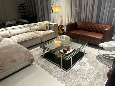 Modern glass coffee table with metal frame — excellent condition