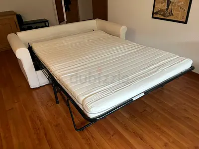 White three-seater pull-out sofa bed with mattress