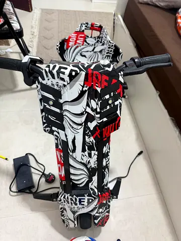 Electric kick scooter with graphic deck and charger (used)