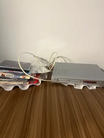 Sony DVD player with mixed DVDs (assorted movies) — working condition