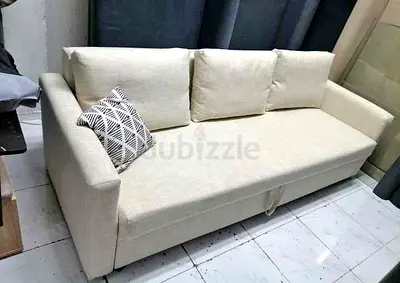 Comfortable 3-Seater Fabric Sofa bed with storage in Cream