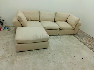 Pottery barn beige color modular sofa with ottoman