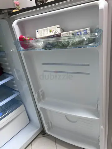 Small top-freezer refrigerator in good working condition