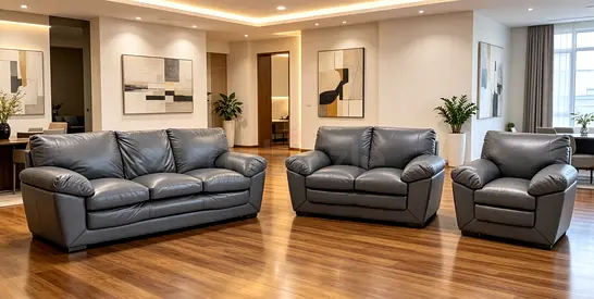 3-piece grey leather sofa set (3-seater, 2-seater, armchair) in good condition