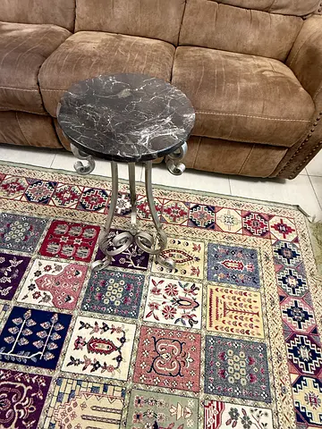 Round marble-top side table with metal legs