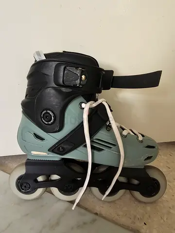 Used pair of adjustable adult inline rollerblades - size adjustable, good condition