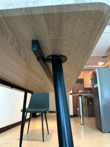 Wooden dining table with black metal legs - good condition