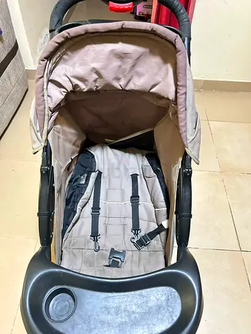 Used single baby stroller with canopy and tray - beige