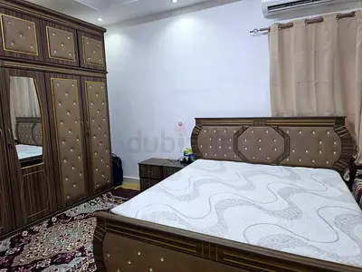Brown tufted bedroom set with double bed, wardrobe and nightstand غرفة نوم