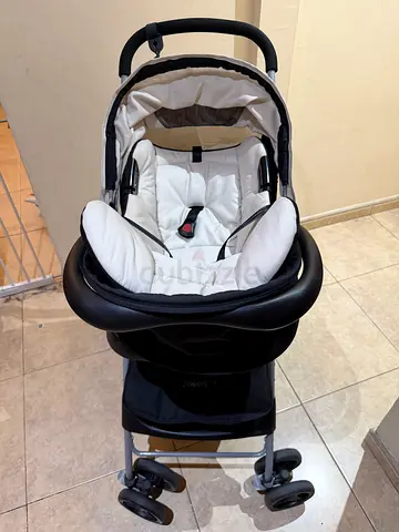 Black and white infant travel stroller with detachable car seat - good condition