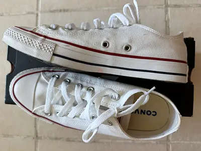 White low-top Converse style sneakers