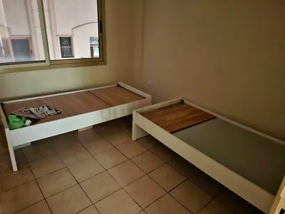 Two single white wooden bed frames - good condition