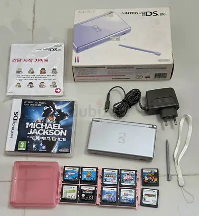 Silver Nintendo DS Lite bundle with charger, styluses, 11 games + box