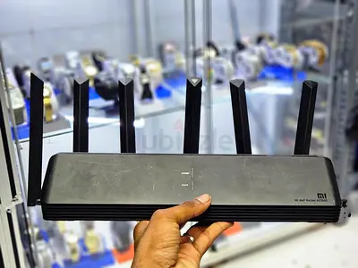 Xiaomi Mi AIoT Router AX3600 with a black, ventilated plastic casing.