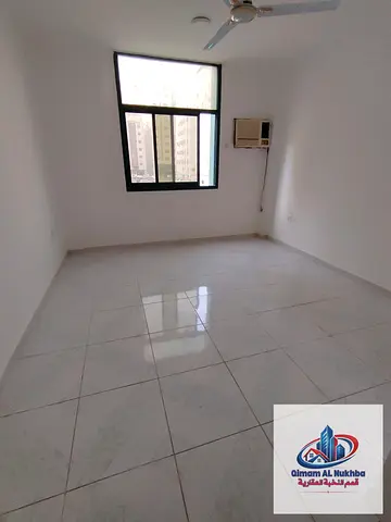 Spacious studio in Al Qasimia with semi-separate kitchen, prime location close to services, annual