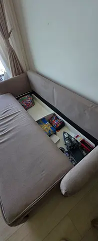 Sofabed with storage in a very good condition, It has some cat scratches in the sides of it only