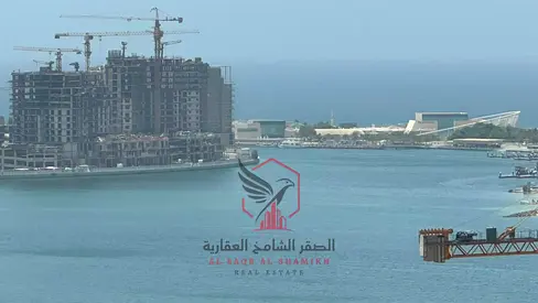 Two-bedroom apartment with living room in Al Majaz 2, balcony with open view, free parking, prime location near all services and easy access to Dubai.