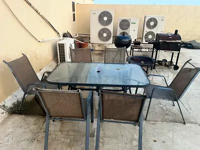 Outdoor table with 6 chairs and pillows