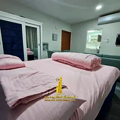 Luxury studio with separate kitchen, furnished, for monthly rent in Ajman - Al Rashidiya 2 - behind 