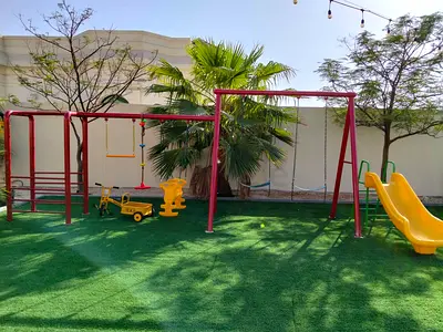 Outdoor kids playground set with swings, slide and play equipment