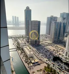 Land for sale in Sharjah - Al Majaz 2 area. Building permit for ground + first floor parking + 7 rep